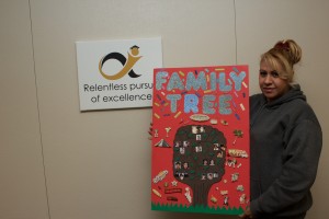 Maria Martinez shows off her Family Tree project.